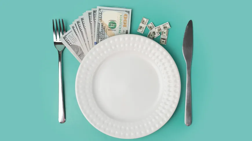 plate with silverware and money